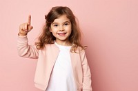 Kid girl pointing portrait smile child. AI generated Image by rawpixel.