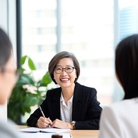 Asian senior female conversation interview contract. 