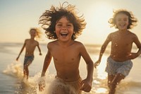 Kids playing laughing outdoors beach. 