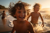 Kids playing beach laughing portrait. 