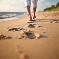 Human footsprint on sand beach in summer,. 