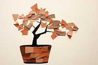 Potted bonsai art plant paper.