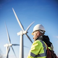 photo of wind turbine worker checking installation. 