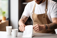 Barista preparing beverage barista coffee cup. 