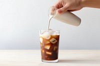 Iced coffee milk pouring drink. 