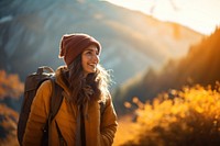 Photo of happy smiling woman hiking in mountains. 