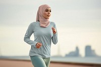 Woman in fashion hijab jogging