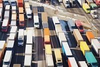 Highway filled with colorful trucks outdoors vehicle road.