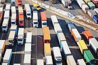 Highway filled with colorful trucks outdoors vehicle road.