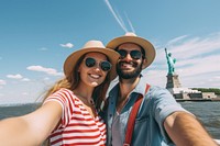 Selfie couple ferry statue. 