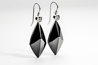 Earrings jewelry black white background.