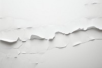 A torn strip on white paper line backgrounds textured abstract.