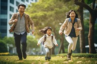 Young asian family outdoors walking adult. AI generated Image by rawpixel.