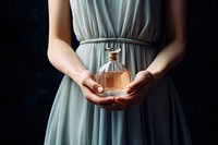 Perfume bottle glass hand. AI generated Image by rawpixel.