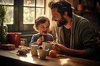 Baby feeding father coffee. 