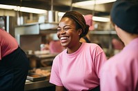 A black woman fast food employee laughing adult smile. 