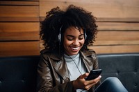 Headphones smiling sitting holding. 