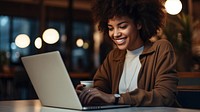 Woman using a laptop computer adult portability. 