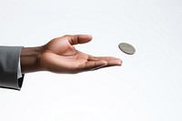 Businessman's hand tossing a coin. 