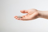 Hand tossing a coin. 