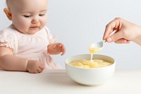 Spoon baby food eating. 