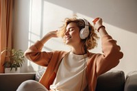 Headphones sitting adult woman. 