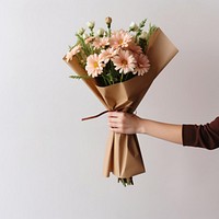 Flower bouquet holding plant paper. 