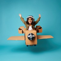 Little girl flying a cardboard airplane. 