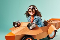 Little girl flying a cardboard airplane. 