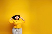 photo of a happy chubby woman wearing earphones.  