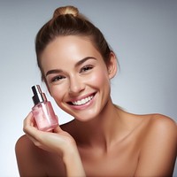 Smiling woman cosmetics applying portrait. 