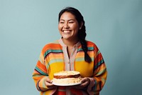 Native woman smile cake dessert. AI generated Image by rawpixel.