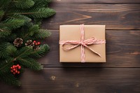 Hands exchanging gift box christmas wood anticipation. 