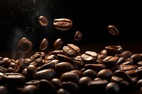 Roast coffee beans black black background refreshment. 