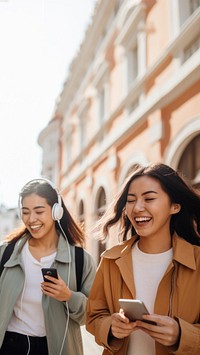 Two female asian friends laughing adult togetherness. 