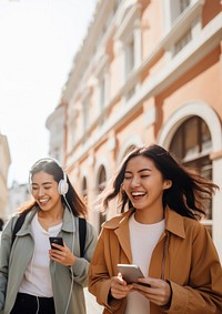 Two female asian friends laughing togetherness architecture. 