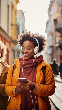 Two female black friends headphones adult architecture. 