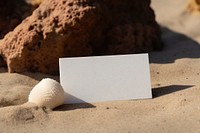 Business card sand outdoors seashell. 