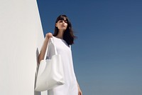Hold white tote bag outdoors handbag dress. AI generated Image by rawpixel.