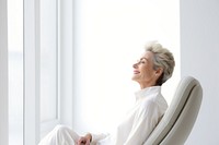 Senior woman sitting window adult. 