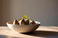 Ceramic bowl plant table fruit. 