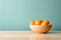 Ceramic bowl orange fruit table. 