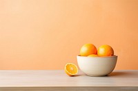 Ceramic bowl orange fruit table. 