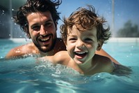 Little boy swimming laughing portrait. 