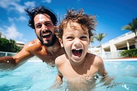 Little boy swimming laughing father. 