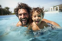 Little boy swimming laughing portrait. 