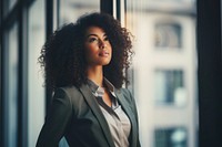 Businesswoman standing window office. 