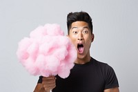 Asian man eating cottoncandy happiness surprised vitality. 