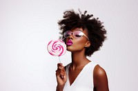 Black woman eating lolipop lollipop adult food. 