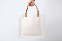 Man holding blank tote bag handbag white accessories. 